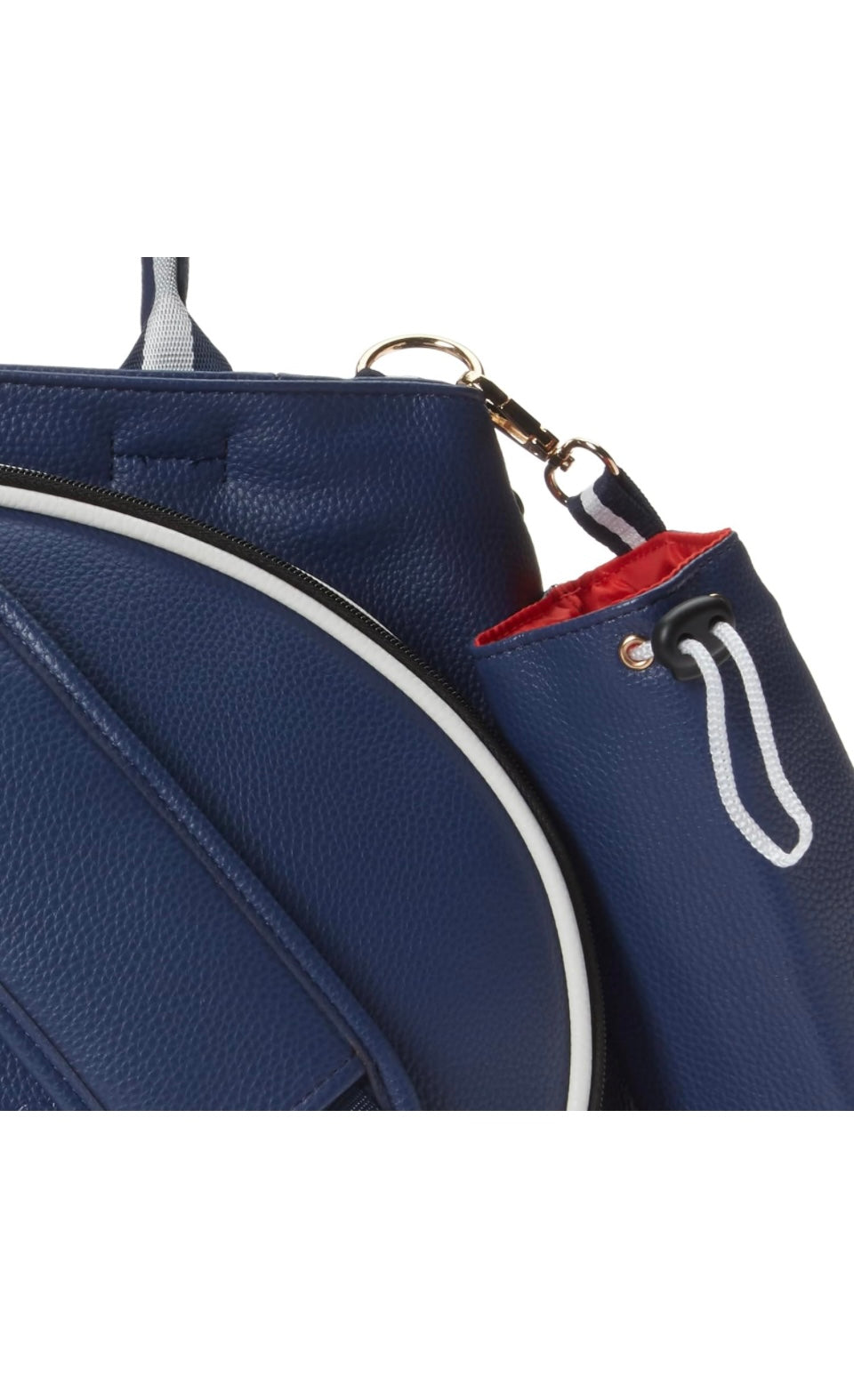 The SamLouise London 77 Tennis Tote from SamLouise is a chic sports tote bag in blue with white accents and a detachable strap. It includes a zippered bottom compartment, an insulated bottle holder, and a cylindrical pouch on the side.