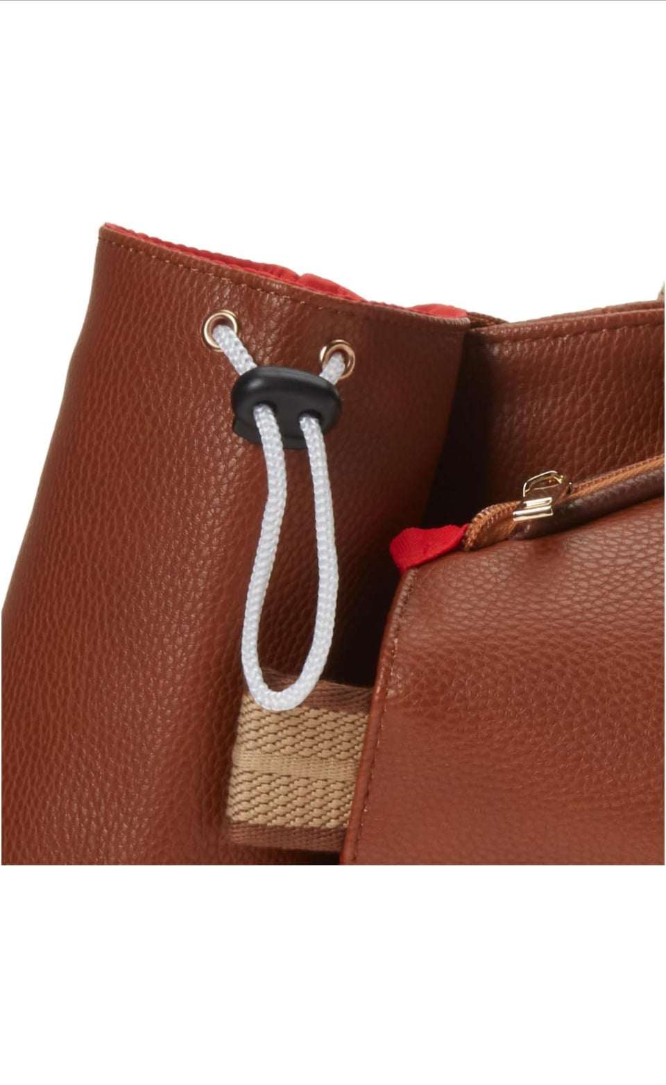 The SamLouise London 77 Tennis Tote from SamLouise is a chic sports tote bag in blue with white accents and a detachable strap. It includes a zippered bottom compartment, an insulated bottle holder, and a cylindrical pouch on the side.