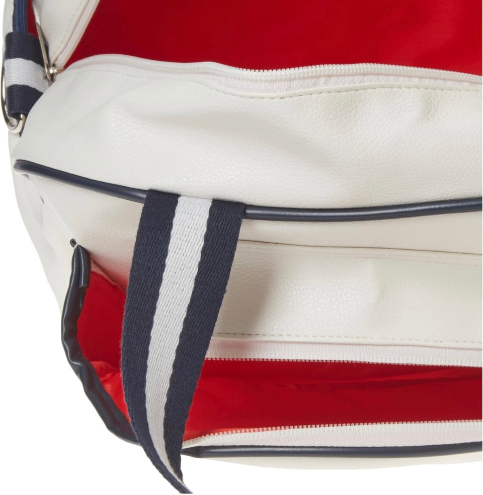 Introducing the SamLouise England 68 Pickleball Bag: a chic red bag crafted from eco-friendly vegan leather. It features zippered pockets and a shoulder strap adorned with white accents, all showcased against a pristine white background.