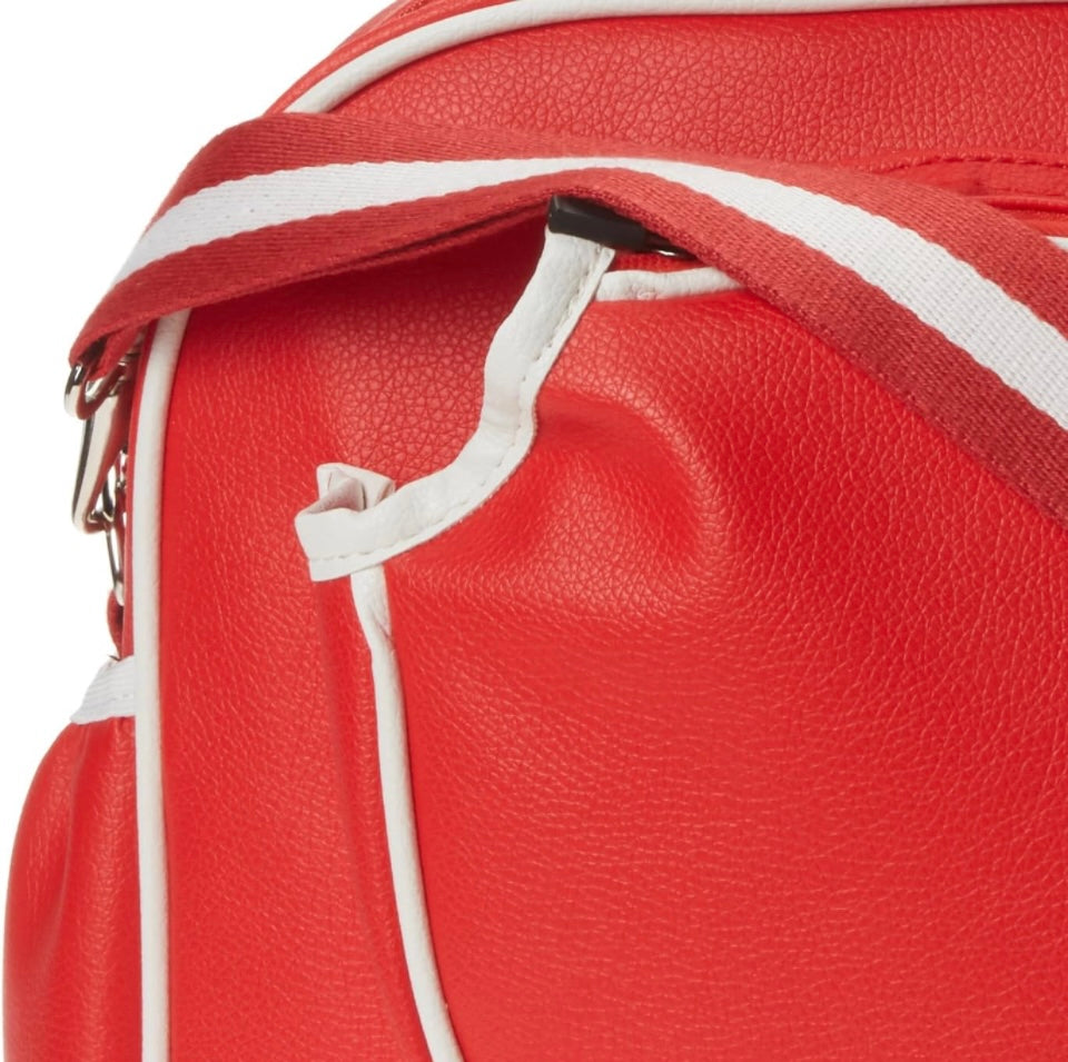 Introducing the SamLouise England 68 Pickleball Bag: a chic red bag crafted from eco-friendly vegan leather. It features zippered pockets and a shoulder strap adorned with white accents, all showcased against a pristine white background.