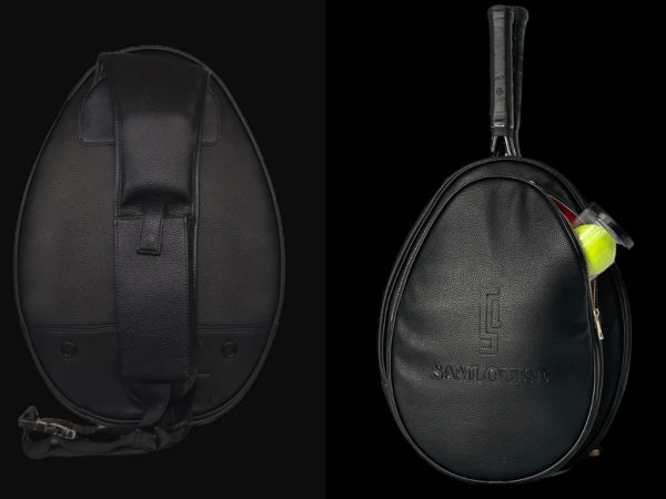 The sleek SamLouise West Side 72 Sling Backpack is black and oval-shaped, featuring a top handle with SamLouise embossed on the front. Made from vegan leather, it has a zippered pocket that includes a tube of tennis balls.