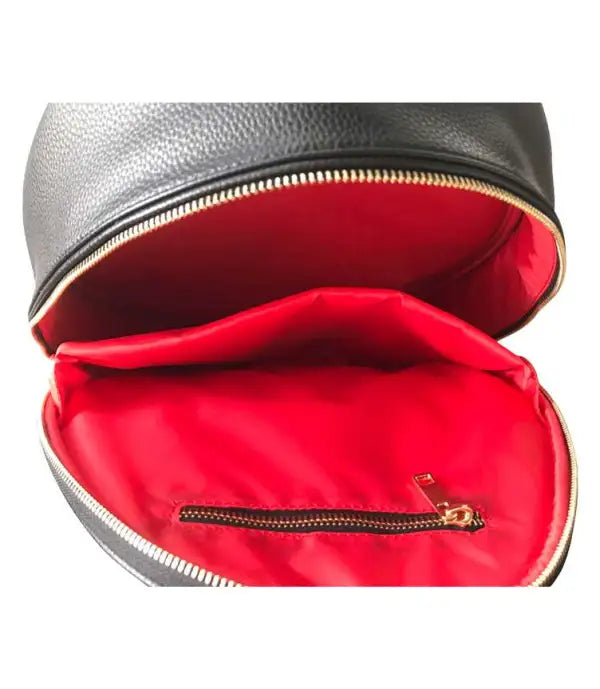 The sleek SamLouise West Side 72 Sling Backpack is black and oval-shaped, featuring a top handle with SamLouise embossed on the front. Made from vegan leather, it has a zippered pocket that includes a tube of tennis balls.