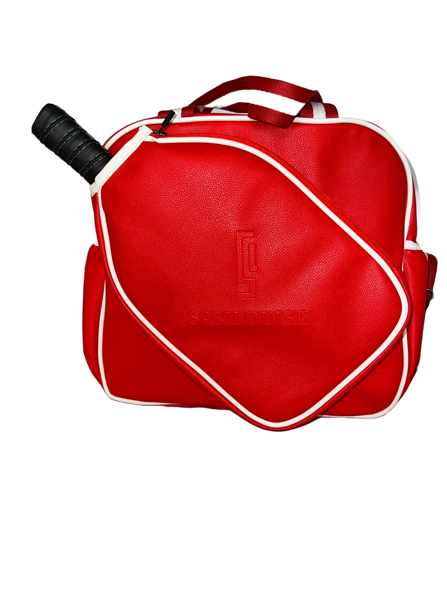 Introducing the SamLouise England 68 Pickleball Bag: a chic red bag crafted from eco-friendly vegan leather. It features zippered pockets and a shoulder strap adorned with white accents, all showcased against a pristine white background.