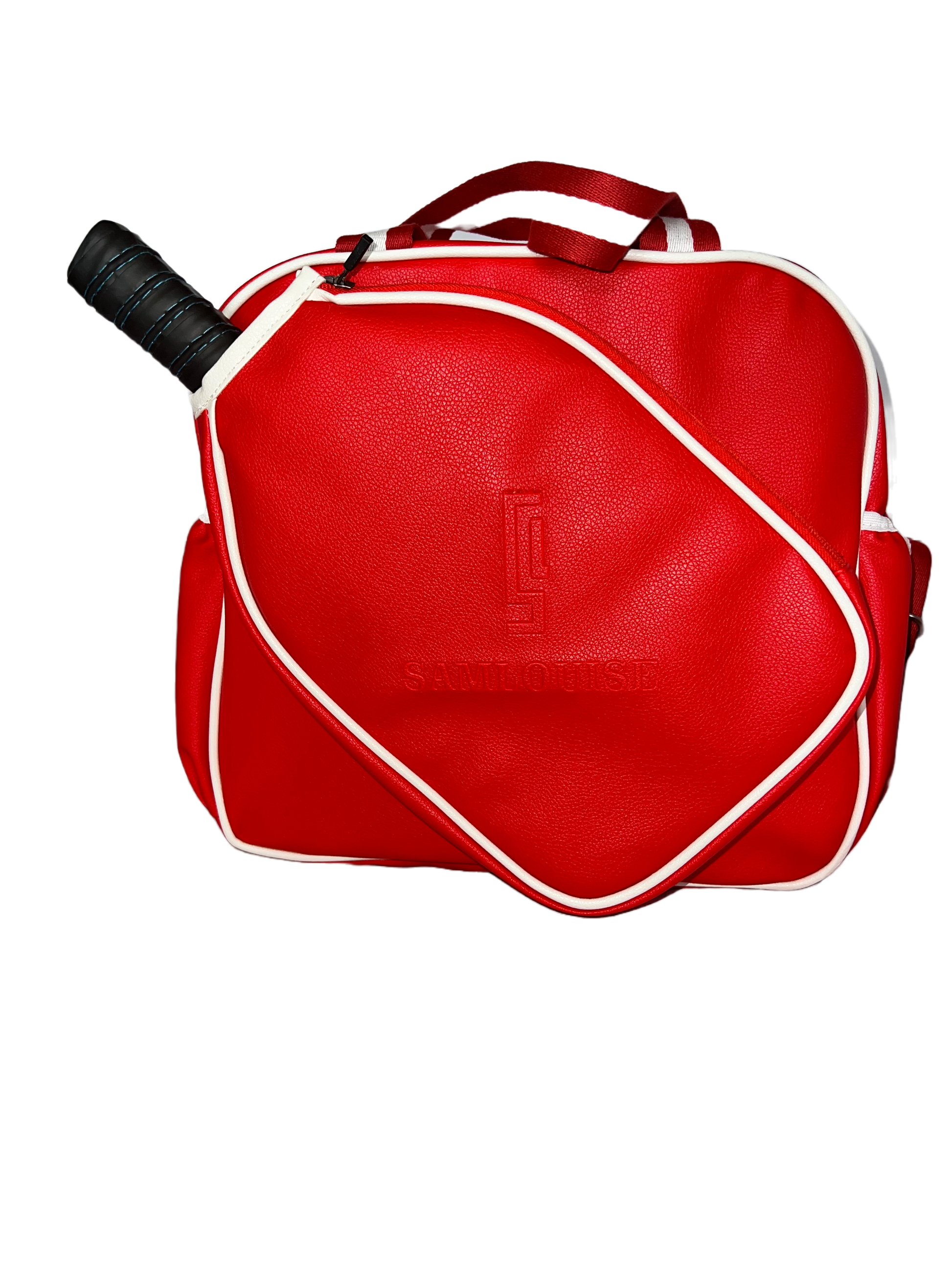 Introducing the SamLouise England 68 Pickleball Bag: a chic red bag crafted from eco-friendly vegan leather. It features zippered pockets and a shoulder strap adorned with white accents, all showcased against a pristine white background.